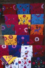 MEXICO, Chiapas, Zinacantan, Brightly coloured embroidered local textiles.