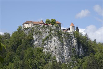 SLOVENIA, Lake Bled, Bled Castle perched on high cliffs above the Lake