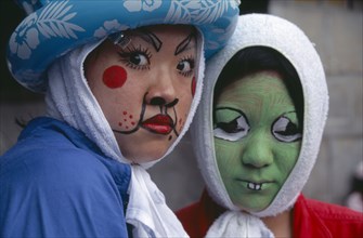 JAPAN, Honshu, Tokyo, Harajuku District. Portrait of two girls wearing face paint