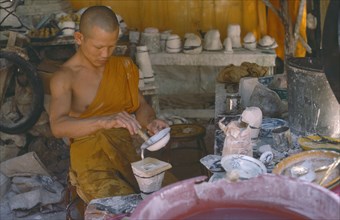 THAILAND, Religion, People, Monk making Buddhist casts.