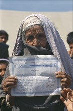 PAKISTAN, North West Frontier Province, UNHCR camp for refugees from Afghanistan.  Elderly woman
