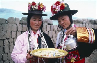 CHINA, Qinghai Province, Huzhu County, Women of Tu nationality and Lamaist Buddhist Yellow Hat sect