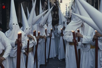 SPAIN, Andalucia, Seville, Penitents in Holy Week procession