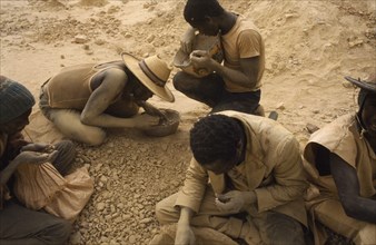 BURKINA FASO, Sahel, Dust covered group of gold miners.
