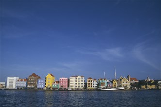WEST INDIES, Dutch Antilles, Curacao, Willemstad.  Colourful waterfront buildings and moored