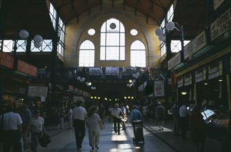HUNGARY, Budapest, Shoppers in hall of Central Market.