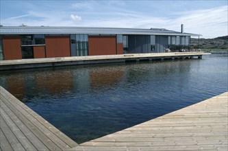 SWEDEN, Goteborg Och Bohus, Skarhamn, Water Colour Museum.  Modern building with water and wooden