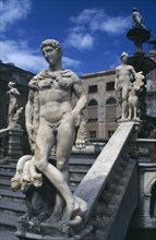 ITALY, Sicily, Palermo, Classical statuary and staircase.