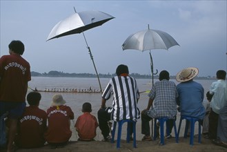 LAOS, Vientiane, Spectators watching boat races on the Mekong River.