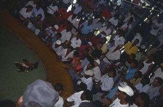 WEST INDIES, Dominican Republic, Angled view of cockfight and spectators.