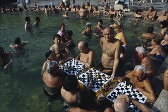 HUNGARY, Budapest, Szechenyi Furdo.  Chess players in thermal baths of spa.