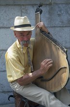 UKRAINE, Yalta, Man playing the bandura.