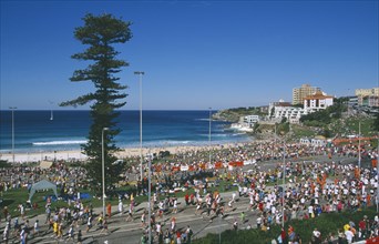 AUSTRALIA, New South Wales, Sydney, Bondi Beach.  Competitors and spectators in annual City to Surf