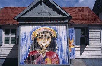WEST INDIES, Windward Islands, Dominica, Roseau.  Mural on exterior of bread shop in the centre of