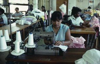 WEST INDIES, Antigua, Coolidge, Workers at sewing machines on floor of Eagle Garment Company.