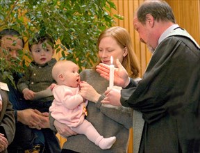 USA, Minnesota, St Paul, Minister performing Naming Ceremony for children in the sanctuary of Unity