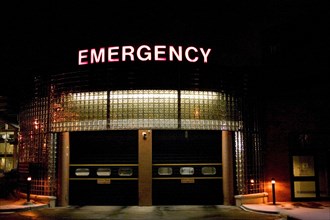 USA, Minnesota, St Paul, Emergency vehicle entrance at United Hospital illuminated at night