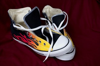 USA, Minnesota, St Paul, Pair of flame Converse Chuck Taylor All Star high top trainers