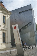GERMANY, Berlin, Visitors walking past entrance to the Jewish Museum designed by Polish architect