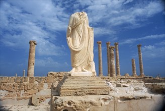 LIBYA, Tripolitania, Sabratha, Headless and armless classical statue on raised plinth with standing