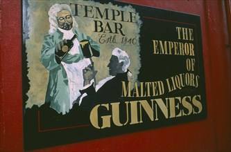 IRELAND, Dublin, Advertisment for Guiness outside pub in the Temple Bar area.
