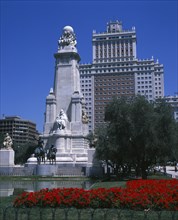 SPAIN, Madrid State, Madrid , Plaza Espana. Stone obelisk with statue of Miguel de Cervantes