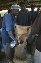 TANZANIA, West, Great Lakes Region, Mkugwa Refugee Camp.  Distribution of food aid supplying