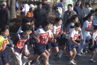 JAPAN, Chiba, Tako, Girls await the start of 2 kilometer race which is part of the towns fitness