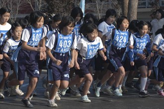JAPAN, Chiba, Tako, 11-12 year old girls starting a 2 kilometer race which is part of the towns