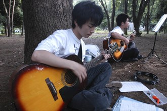 JAPAN, Honshu, Tokyo, "Yoyogi Park. Yuki Nakagawa and Yousuke Koyama, both 15 years old, meet here