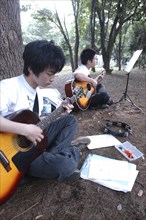 JAPAN, Honshu, Tokyo, "Yoyogi Park Harajuku. Yuki Nakagawa and Yousuke Koyama, both 15 years old,