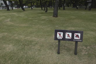 JAPAN, Honshu, Tokyo, "Sign on park grass between Hibiya and Nijubashi prohibiting walking on