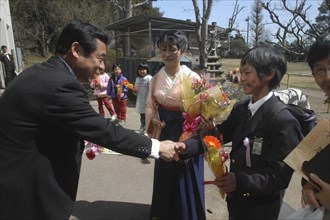 JAPAN, Chiba, Tako, "12 year old Satoshi Ui is congratulated by his principal, Mr. Saito, on his