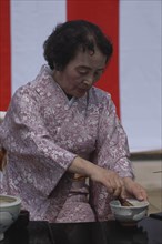 JAPAN, Chiba, Yokaichiba, "Licensed tea master Shikako Namba prepares ""macha"" green tea at a tea