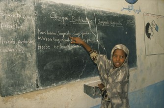 SOMALIA, Baidoa, Dr Ayub Primary School.  Pupil at blackboard.