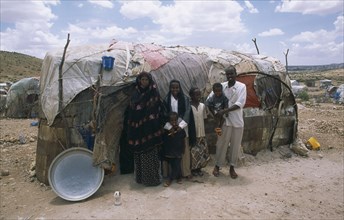 SOMALILAND, Hargeisa, The Kandahr IDP camp for Internally Displaced Persons.  Family standing