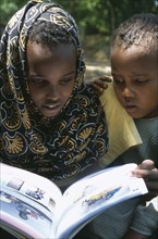 SOMALIA, Habare Village, Children using new Somali textbooks produced by Unicef.
