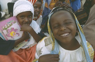 SOMALILAND, Hargeisa, Laughing girl in crowd.