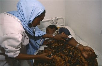 SOMALILAND, Hargeisa, Nurse taking blood pressure of patient in Edna Adan maternity hospital.