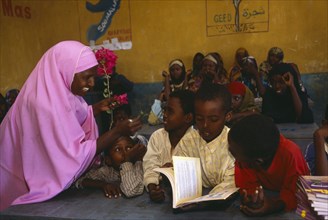 SOMALIA, Baidoa, Female teacher and pupils at Dy Ayub Primary School.