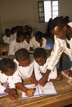 SOMALILAND, Hargeisa, Teacher and pupils in classroom at Gacmodhere Primary School.
