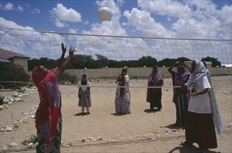 SOMALILAND, Hargeisa, Girls playing volleyball at Fatima Bihi school wearing long skirts and head