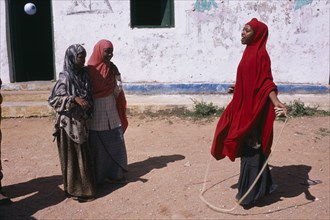 SOMALIA, Baidoa, Girls playing skipping games with rope at Dr Ayub Primary School.