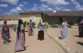 SOMALILAND, Hargeisa, Girls playing volleyball at Fatima Bihi school wearing long skirts and head