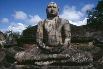 SRI LANKA, Polonnaruwa, The Vatadage. Seated Buddha statue within the quadrangle