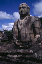 SRI LANKA, Polonnaruwa, The Vatadage. Seated Buddha statue within the quadrangle