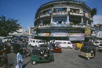 SRI LANKA, Colombo, "Pettah District. Busy street full of traffic including auto-rickshaws, taxis,