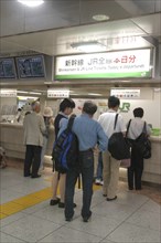 JAPAN, Tokyo , Tokyo station with customers waiting to buy Shinkansen aka bullet train tickets at a