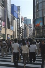 JAPAN, Honshu, Tokyo, Ginza. Pedestrian crossing and view along Chuo-dori avenue at the