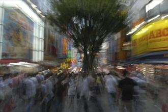 JAPAN, Honshu, Tokyo, Shinjuku. Entertainment district Kabukicho on Saturday evening.  Motion Blur.